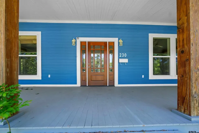 a view of a brick house with a large window