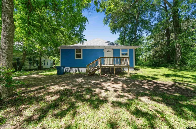 a picture of a bathroom with a shower