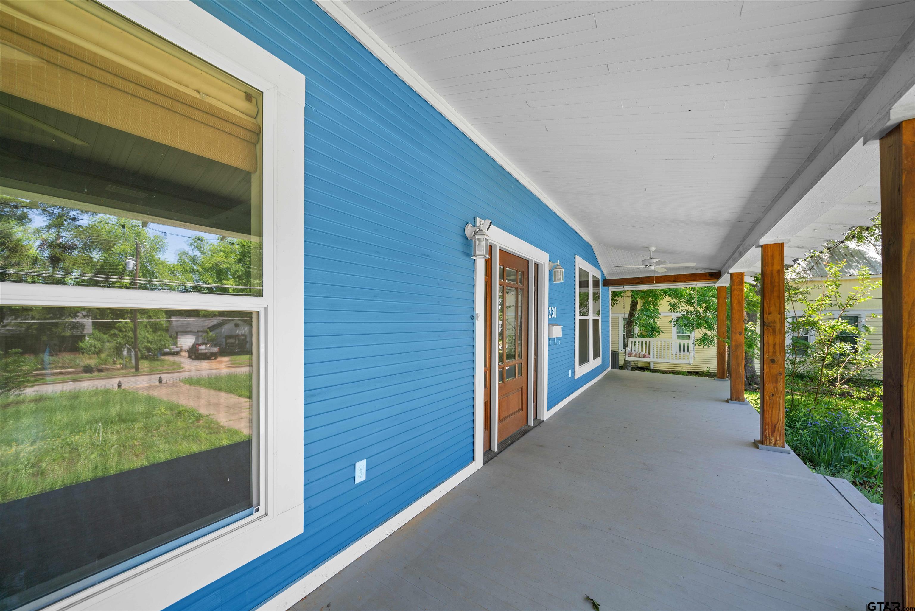 230 North Henderson Street Rusk, TX 75785 - Photo 4 of 34 a view of a porch with wooden floor and garden