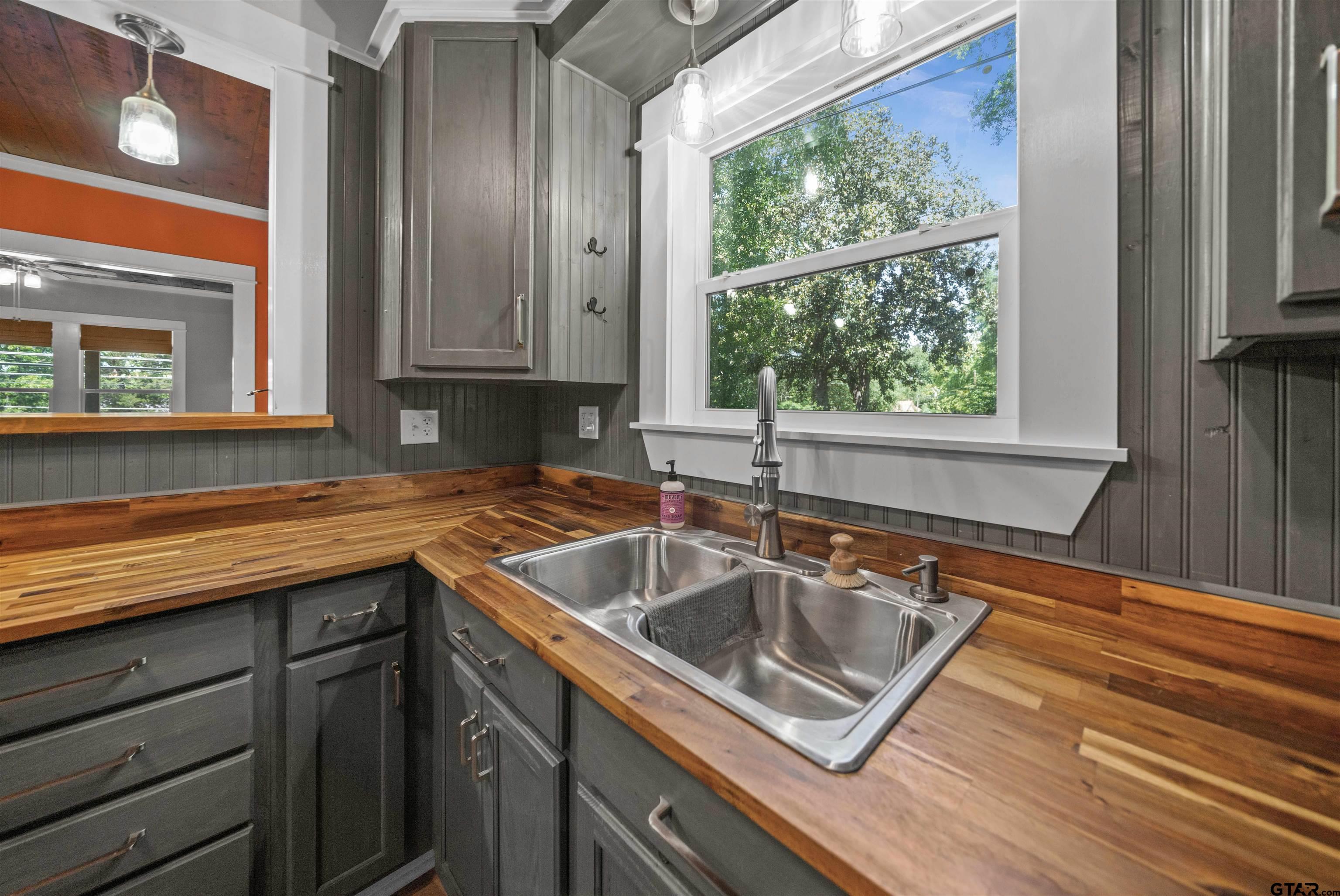 230 North Henderson Street Rusk, TX 75785 - Photo 9 of 34 a kitchen with a sink stove and cabinets