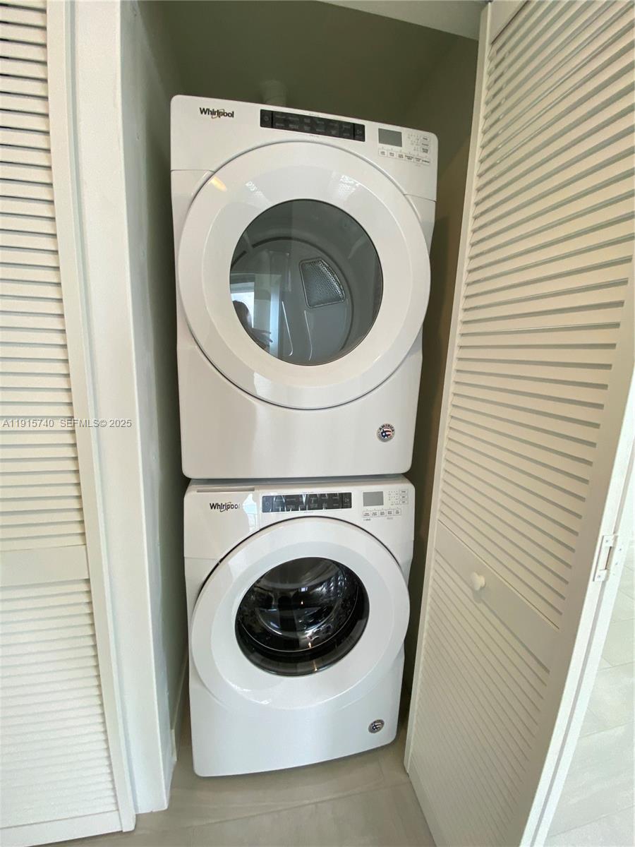 2000 Metropica Way, Unit 2104 Sunrise, FL 33323 - Photo 13 of 62 a utility room with dryer and washer