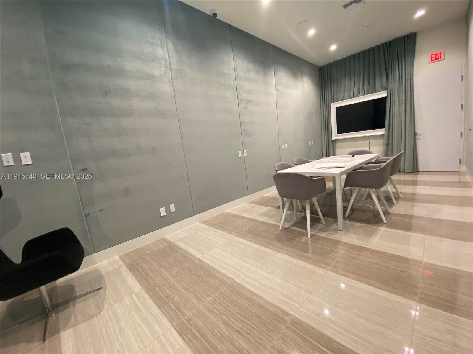 2000 Metropica Way, Unit 2104 Sunrise, FL 33323 - Photo 20 of 62 a living room with a couch and a flat screen tv