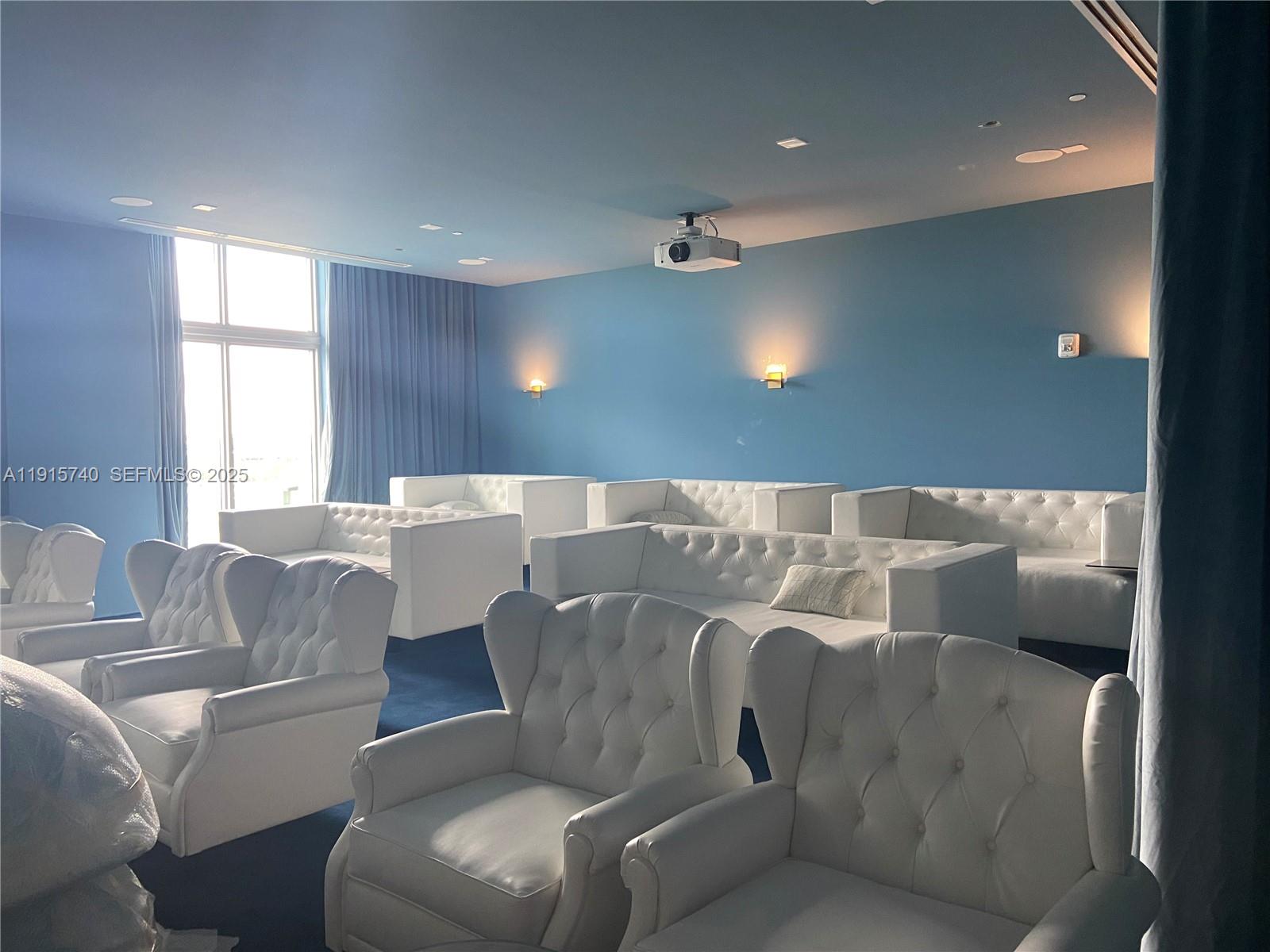 2000 Metropica Way, Unit 2104 Sunrise, FL 33323 - Photo 21 of 62 a living room with furniture and windows