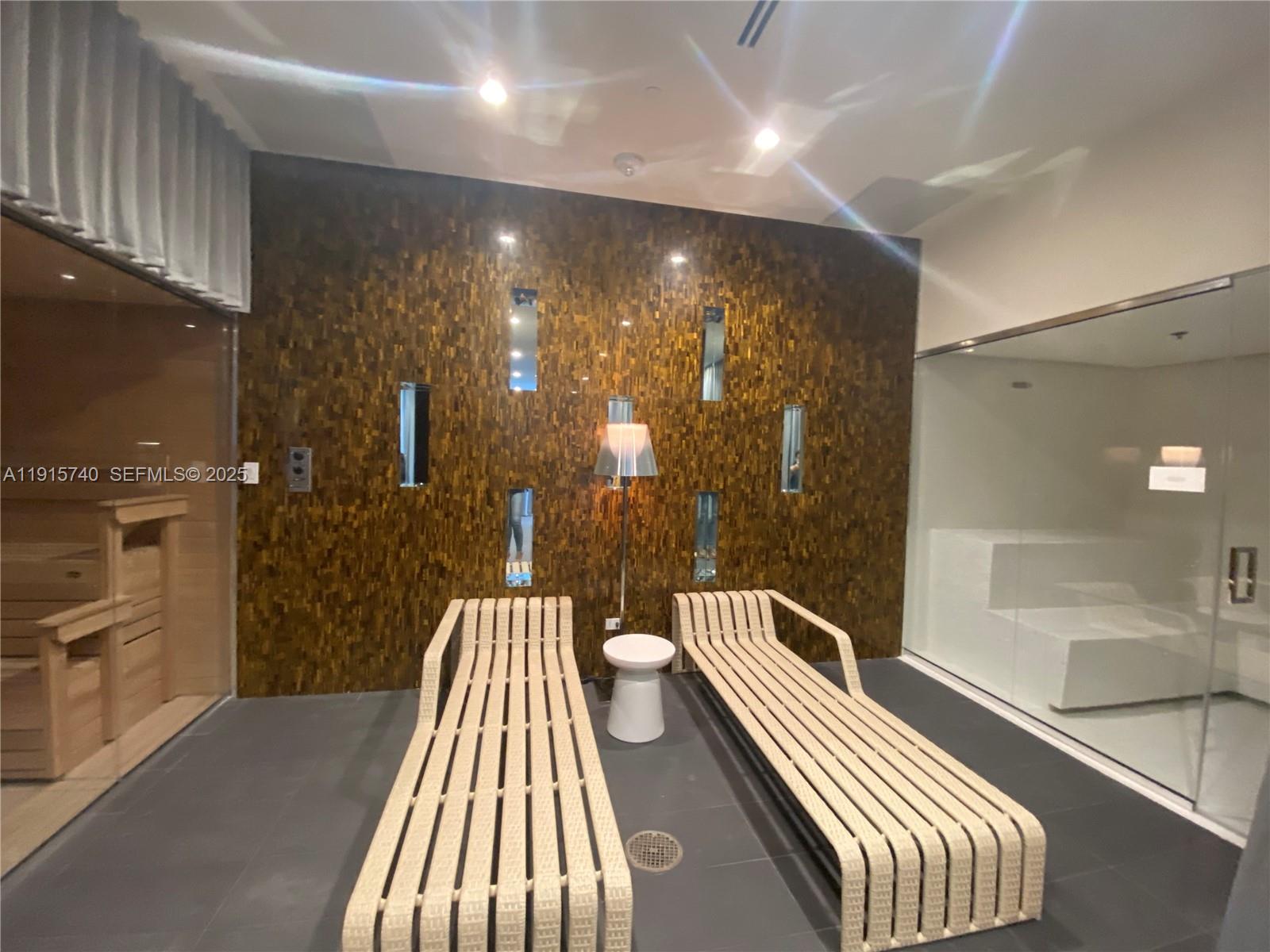 2000 Metropica Way, Unit 2104 Sunrise, FL 33323 - Photo 28 of 62 a bathroom with a bathtub and a shower