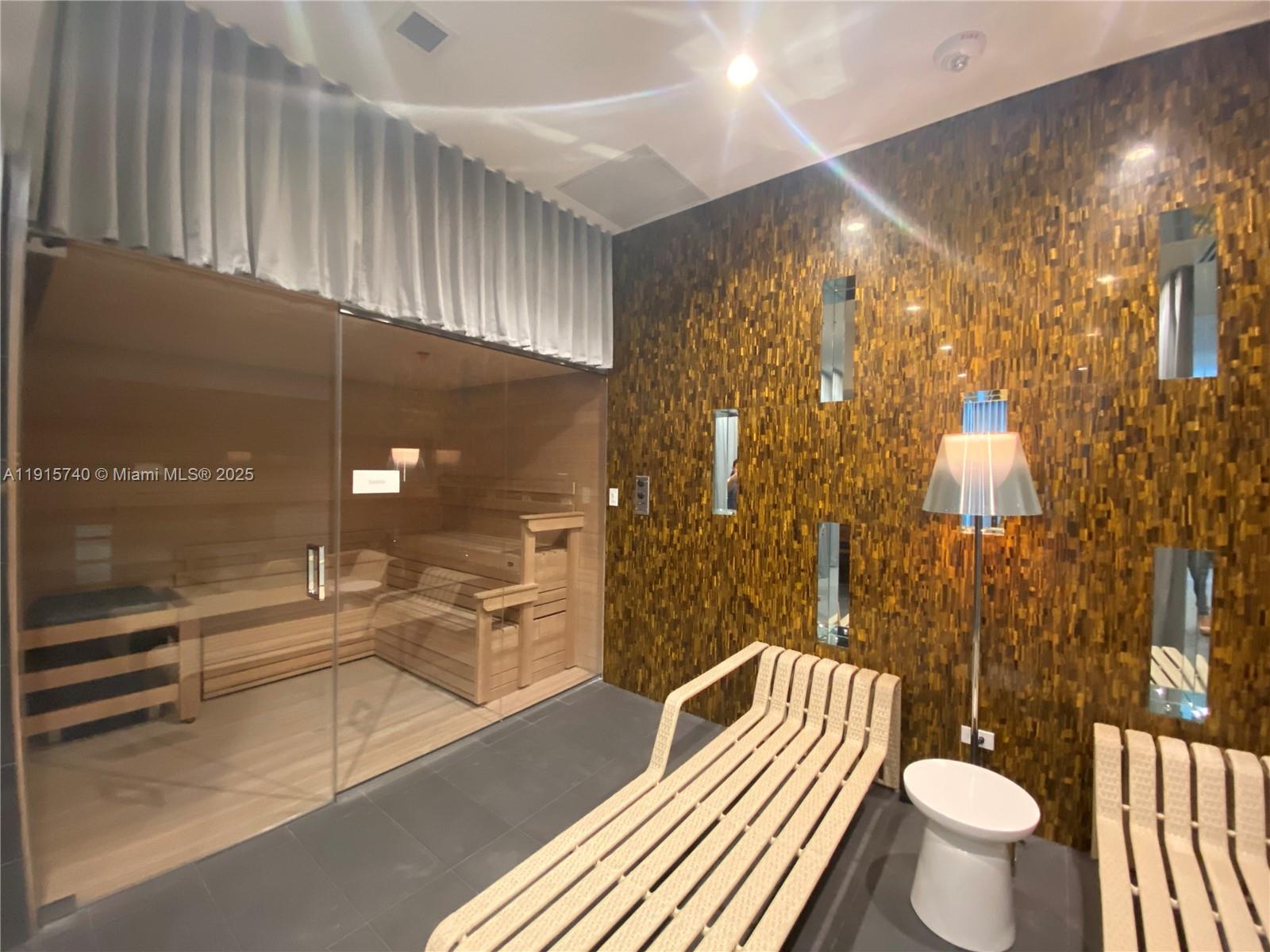 2000 Metropica Way, Unit 2104 Sunrise, FL 33323 - Photo 29 of 62 a bathroom with a sink a toilet and shower