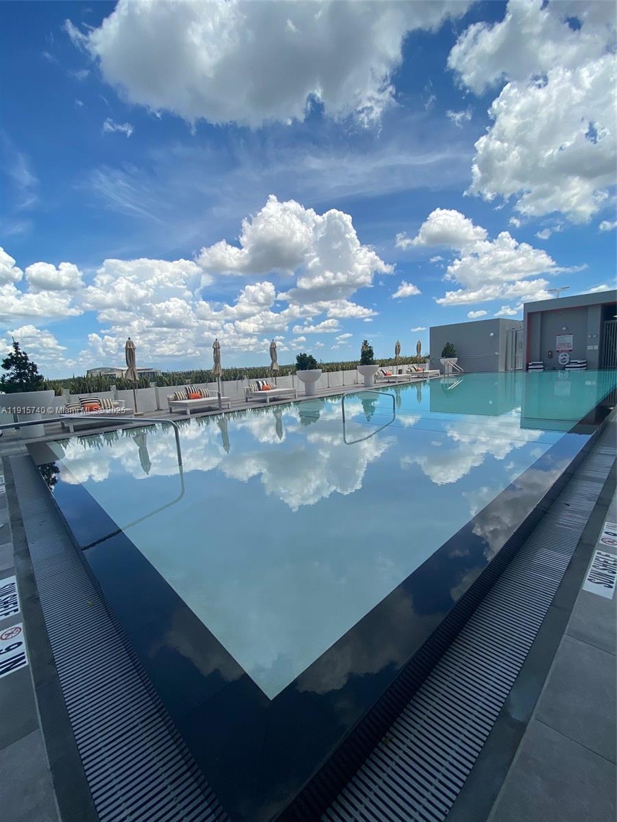 2000 Metropica Way, Unit 2104 Sunrise, FL 33323 - Photo 37 of 62 a view of swimming pool from a balcony