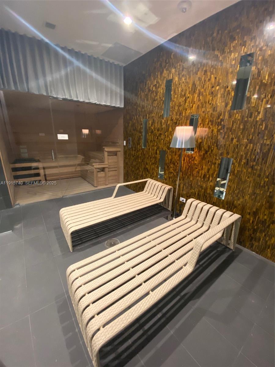 2000 Metropica Way, Unit 2104 Sunrise, FL 33323 - Photo 44 of 62 a bedroom with a bed and bathroom