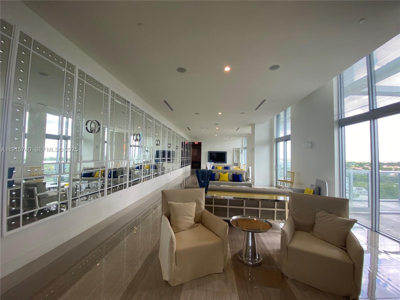 2000 Metropica Way, Unit 2104 Sunrise, FL 33323 - Photo 51 of 62 a living room with furniture and a large window