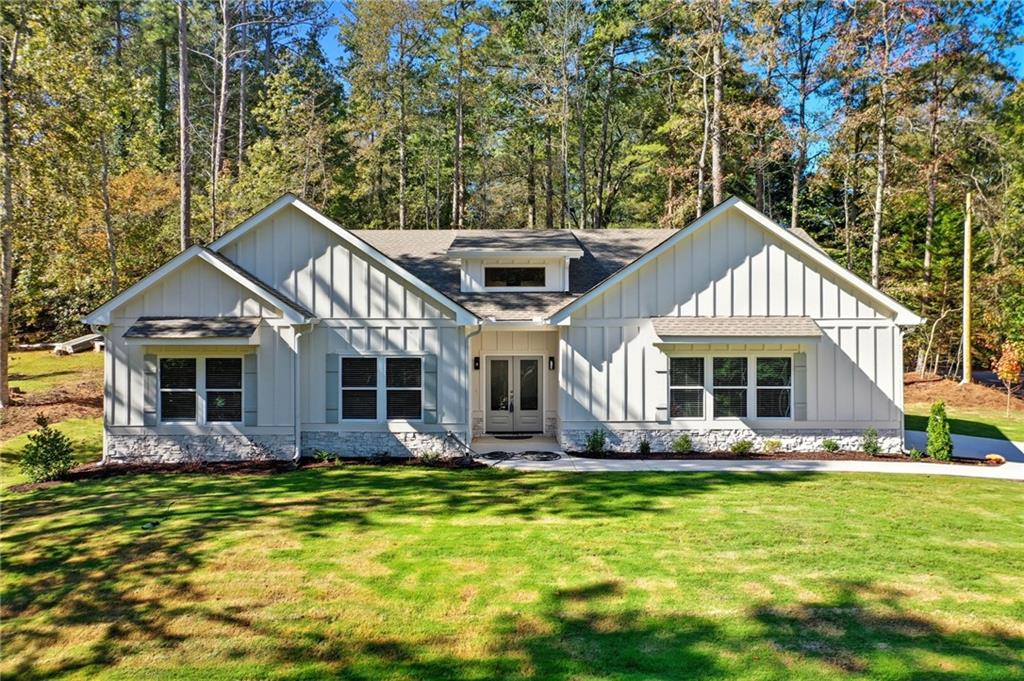 a front view of a house with garden