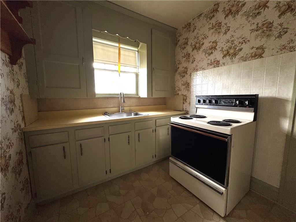 2212 Highland Avenue, Unit 2 New Castle, PA 16105 - Photo 6 of 9 a kitchen with a sink stove and window