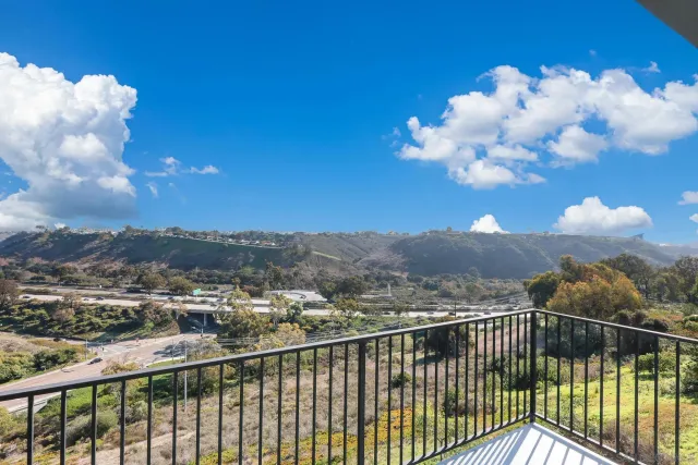 a view of city with sky from balcony