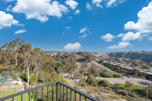 an aerial view of house with yard and outdoor seating