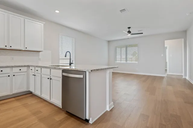 a view of a kitchen with electric appliances
