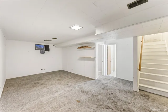 a bathroom with a toilet sink shower and mirror