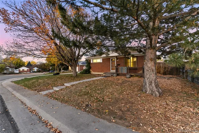 a view of a house with a tree