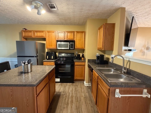 2870 Vining Ridge Terrace Decatur, GA 30034 - Photo 17 of 34 a kitchen with kitchen island granite countertop a sink stove and refrigerator