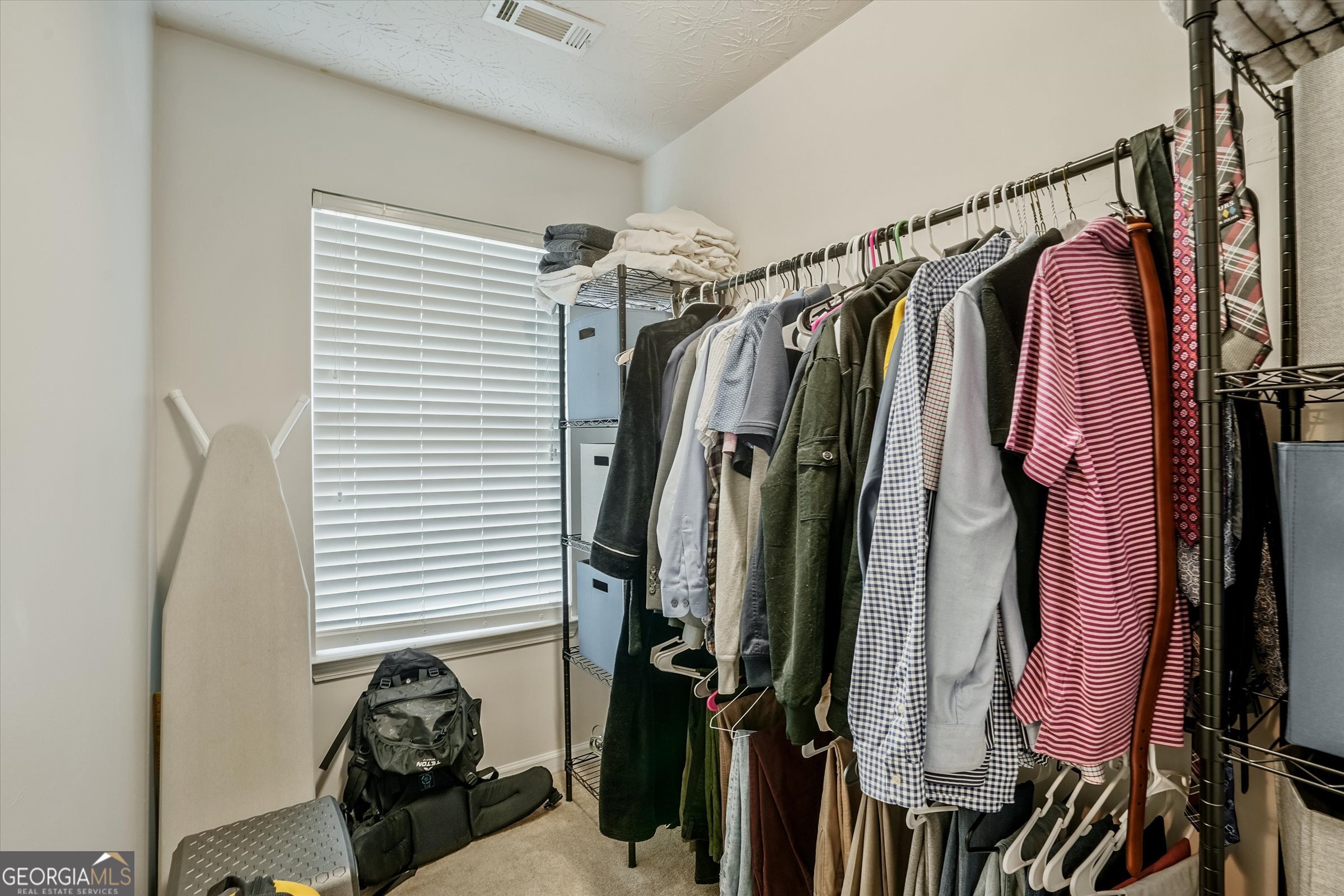 2870 Vining Ridge Terrace Decatur, GA 30034 - Photo 23 of 34 a view of walk in closet with clothes and shoes
