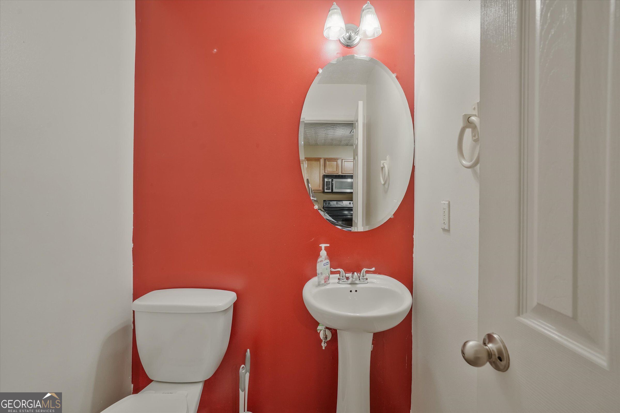 2870 Vining Ridge Terrace Decatur, GA 30034 - Photo 8 of 34 a bathroom with a toilet sink and mirror