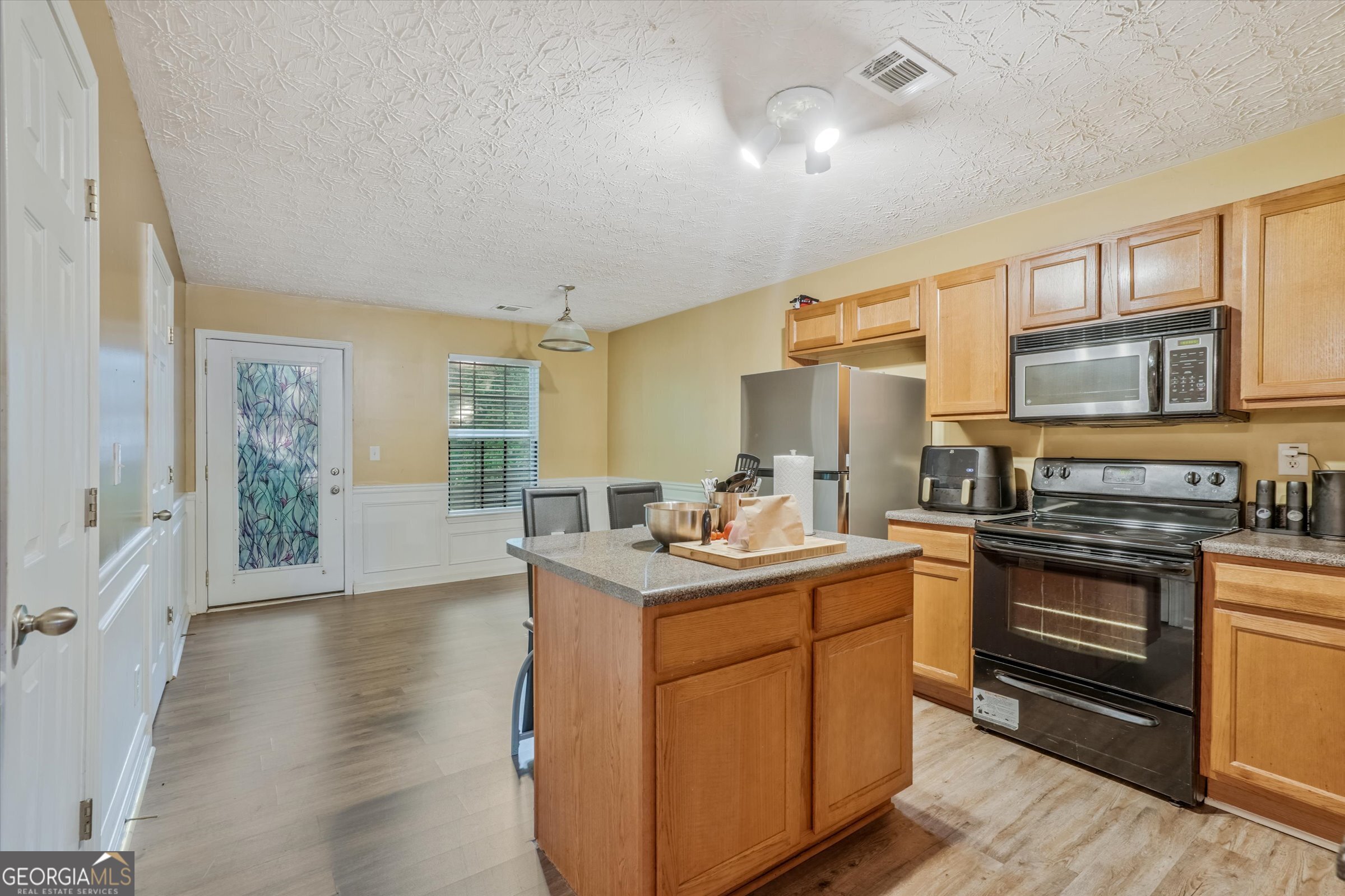 2870 Vining Ridge Terrace Decatur, GA 30034 - Photo 10 of 34 a kitchen with stainless steel appliances granite countertop a stove a sink dishwasher and a refrigerator