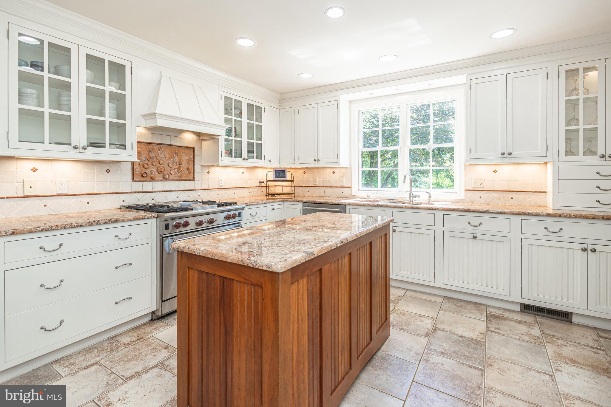 3048 Aquetong Road New Hope, PA 18938 - Photo 12 of 30 a kitchen with a sink stove and cabinets