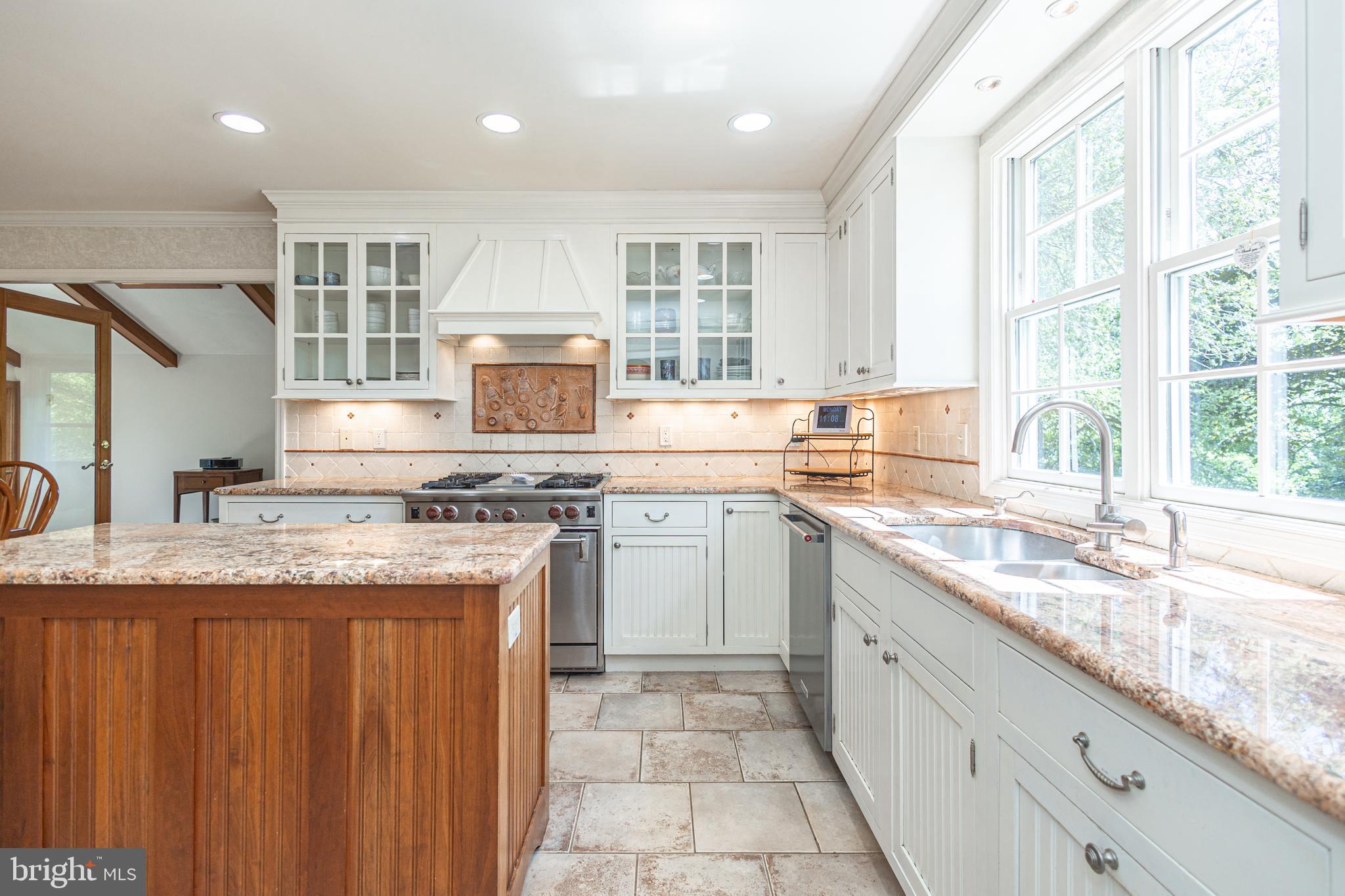 3048 Aquetong Road New Hope, PA 18938 - Photo 13 of 30 a kitchen with granite countertop cabinets stainless steel appliances a sink and a window