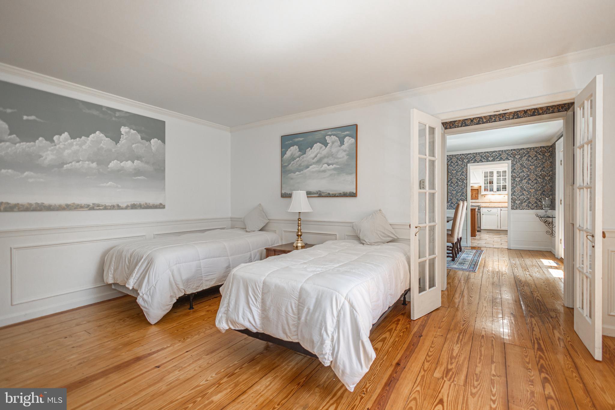 3048 Aquetong Road New Hope, PA 18938 - Photo 17 of 30 a bedroom with two beds and painting on the wall