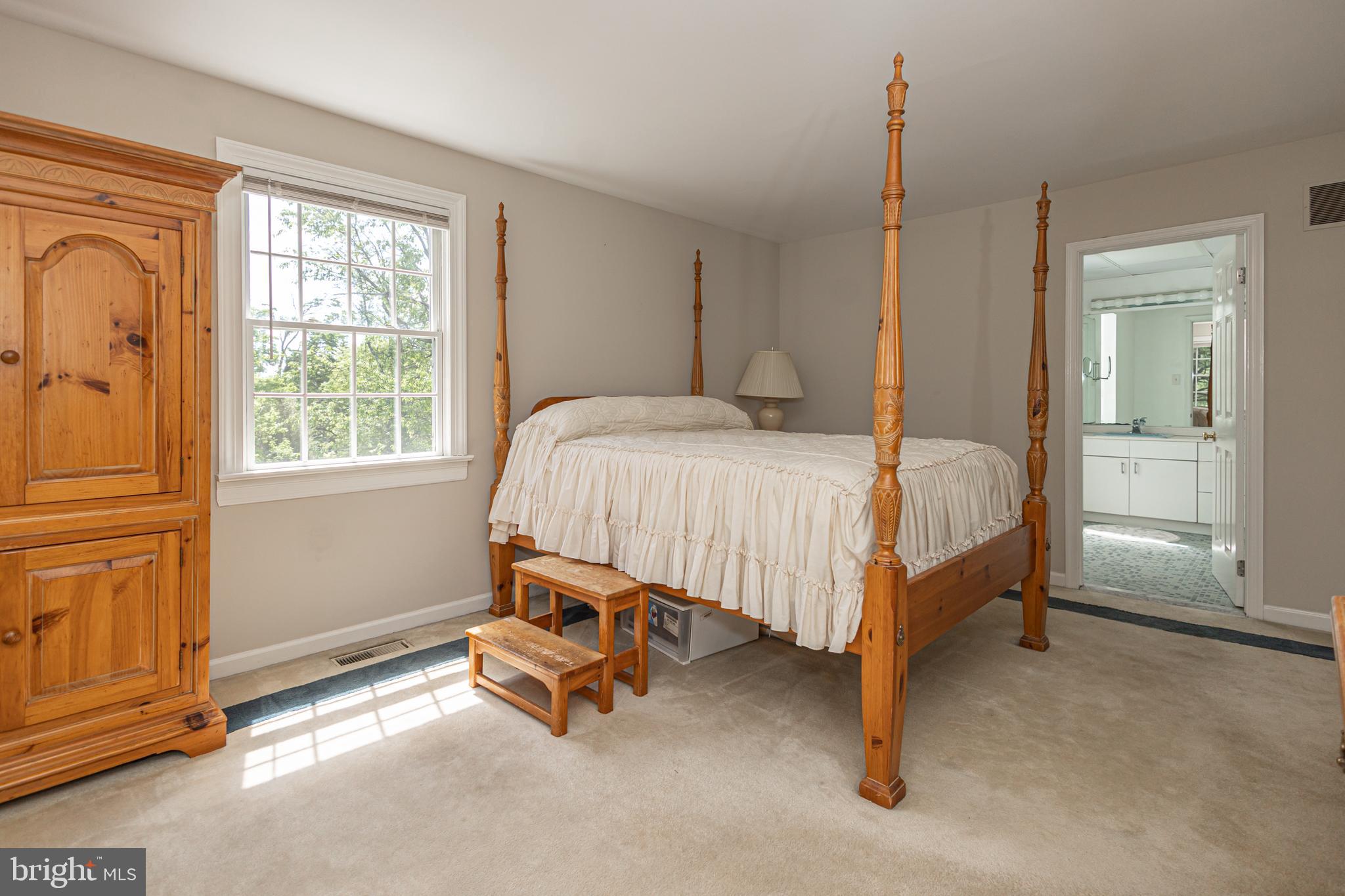 3048 Aquetong Road New Hope, PA 18938 - Photo 19 of 30 a bed sitting in a room next to a window