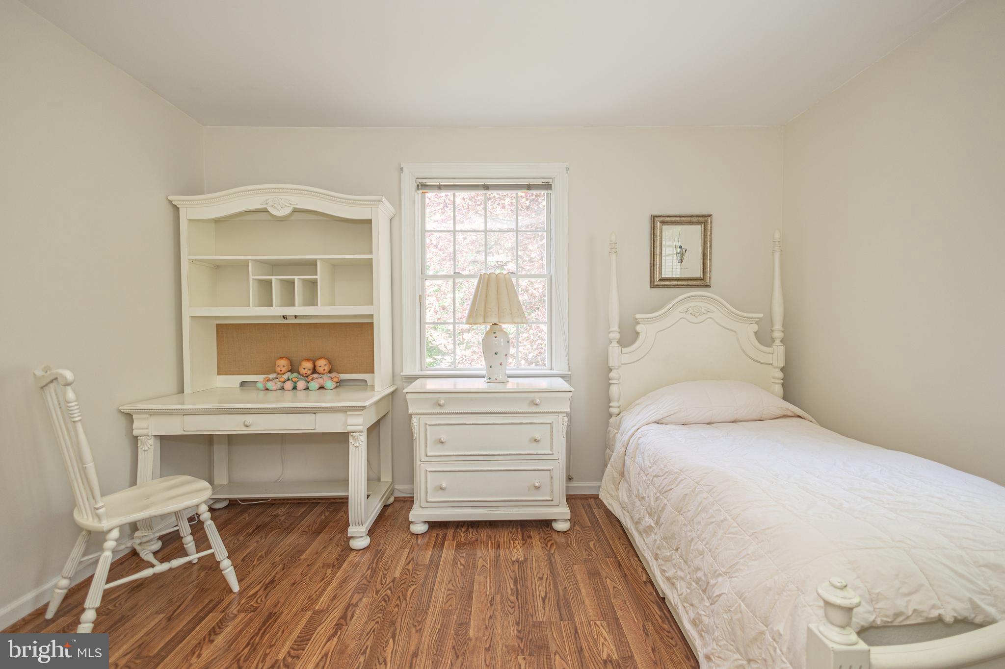 3048 Aquetong Road New Hope, PA 18938 - Photo 21 of 30 a bedroom with a bed and a chair