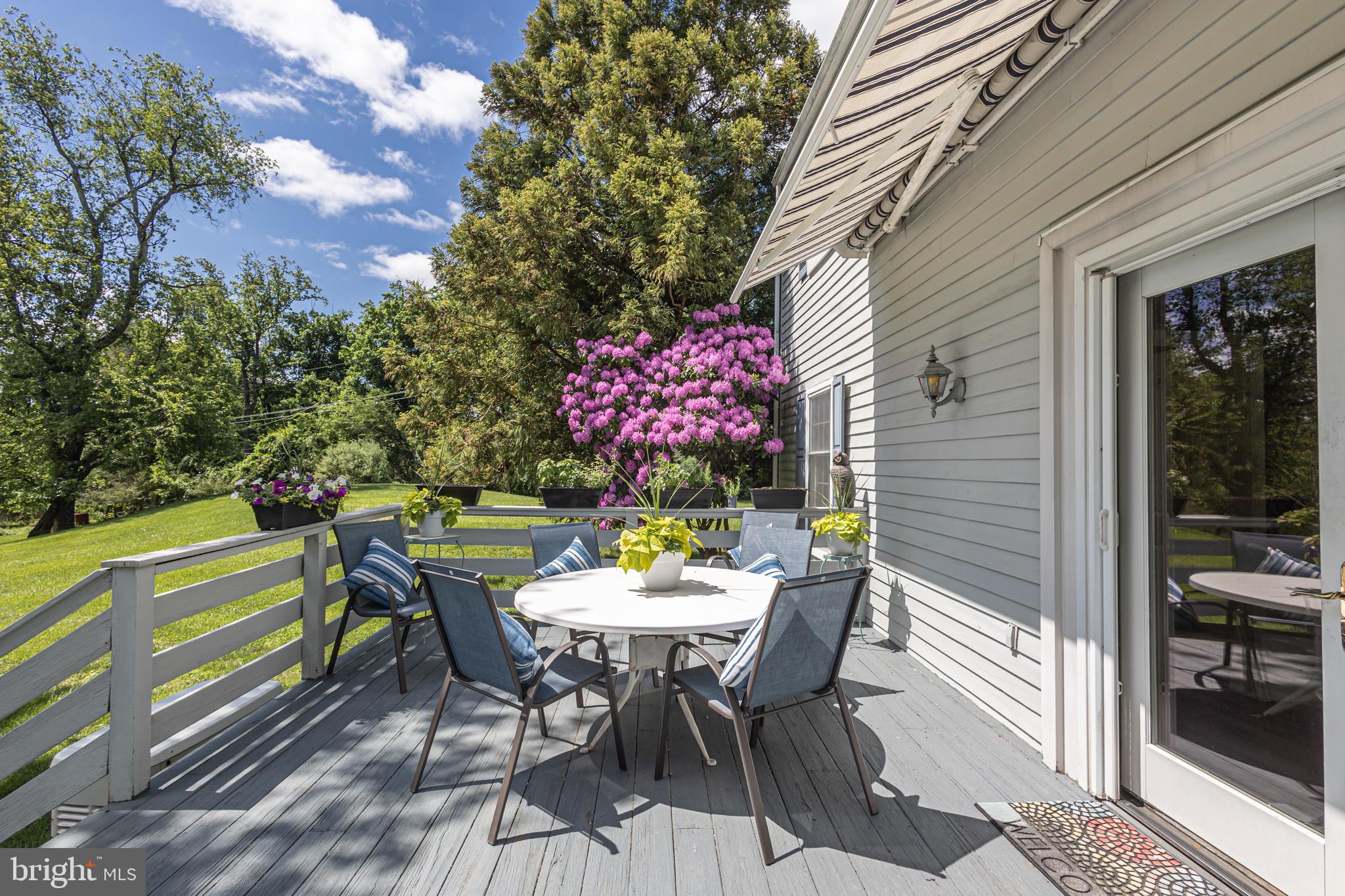 3048 Aquetong Road New Hope, PA 18938 - Photo 22 of 30 a table and chairs in front of a house
