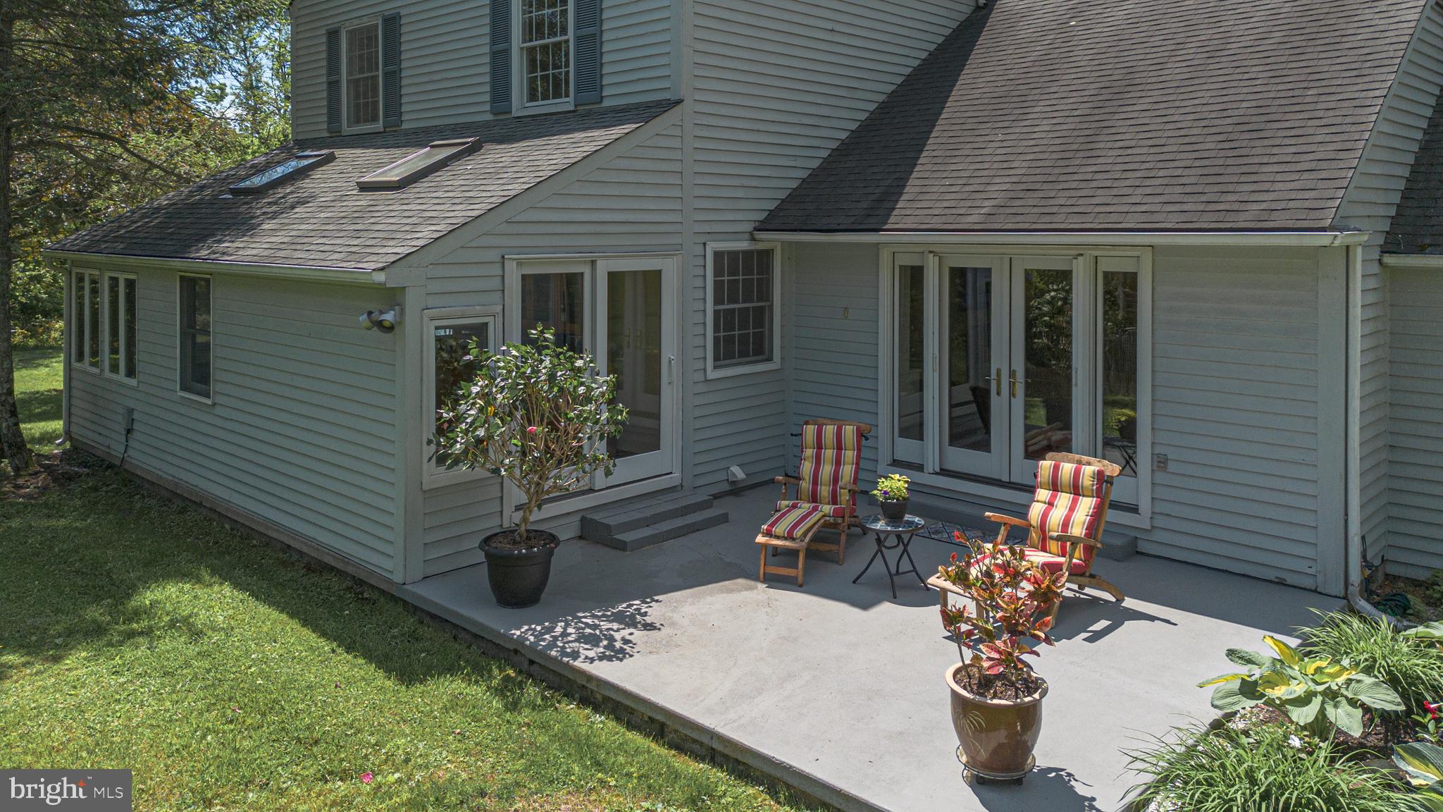 3048 Aquetong Road New Hope, PA 18938 - Photo 28 of 30 a view of a patio with table and chairs and potted plants