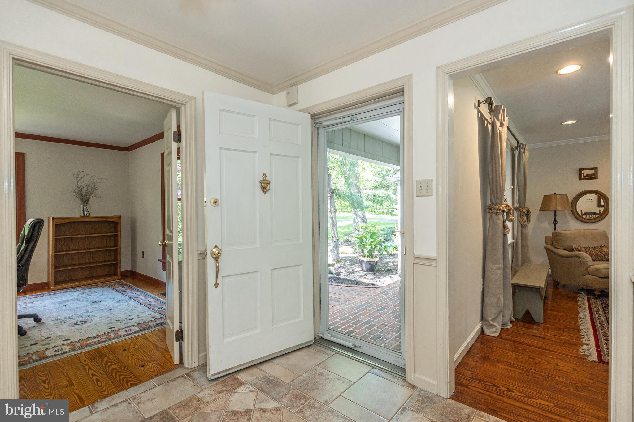 3048 Aquetong Road New Hope, PA 18938 - Photo 6 of 30 a view of a hallway with a livingroom and dining room and wooden floor