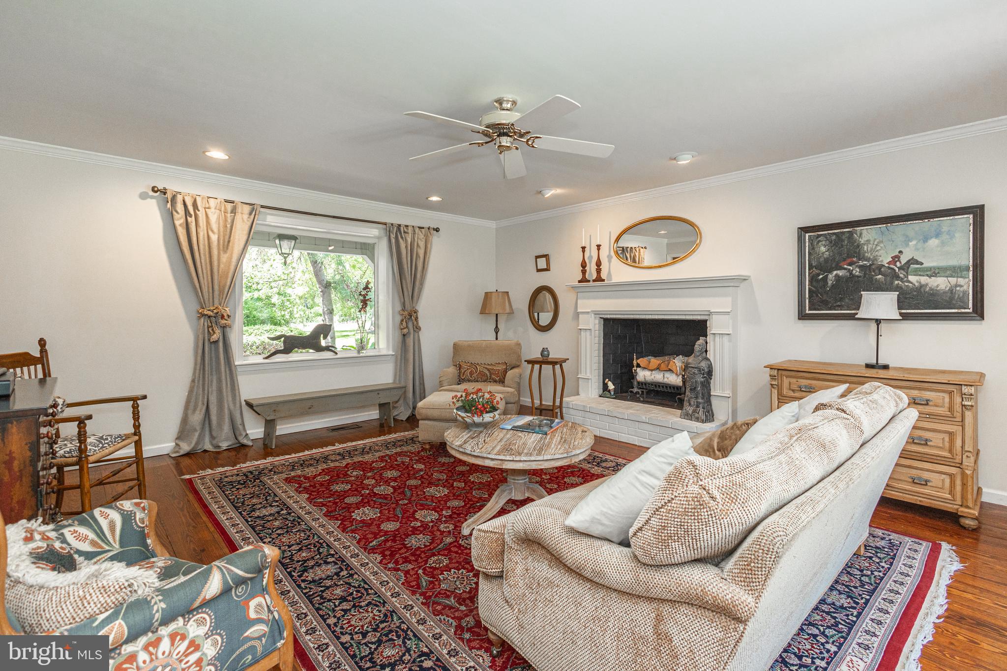 3048 Aquetong Road New Hope, PA 18938 - Photo 9 of 30 a living room with furniture a fireplace and a flat screen tv