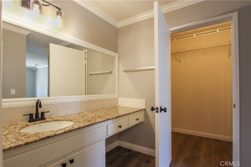 12640 Briarglen Loop, Unit F Stanton, CA 90680 - Photo 11 of 24 Secondary sink and large primary bedroom walk-in closet