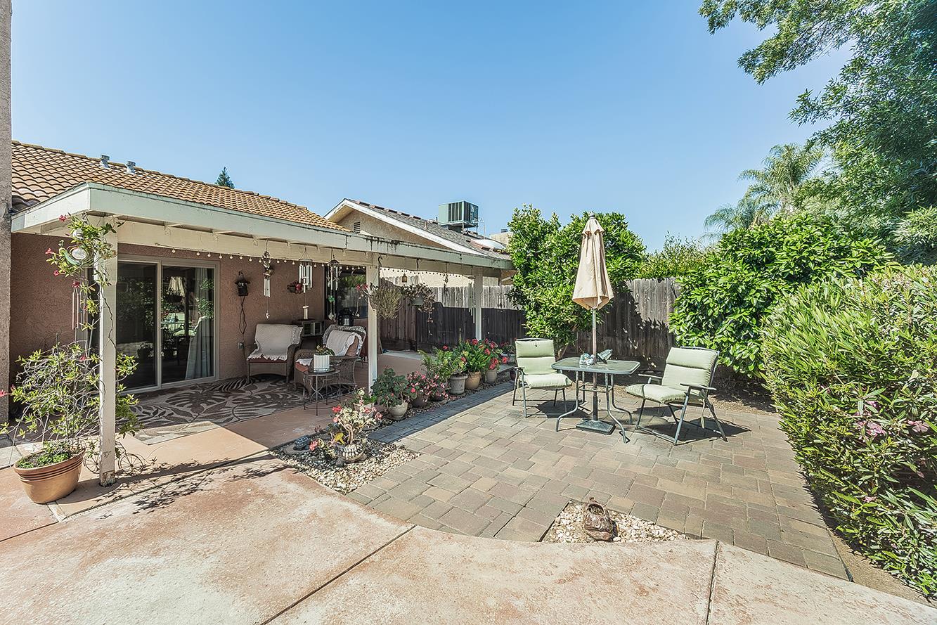 1908 East Niles Avenue Fresno, CA 93720 - Photo 28 of 30 a view of a patio with table and chairs and potted plants