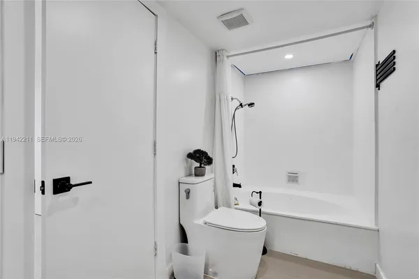 a room with gym equipment and lots of gym equipment