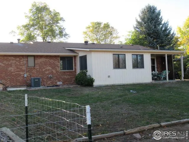 a view front of house with yard and green space