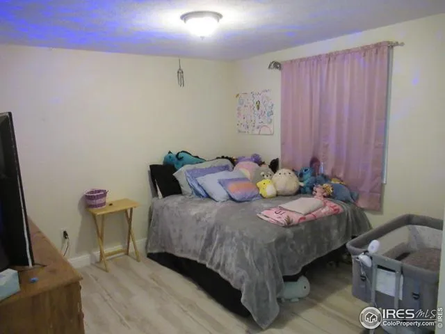 a bedroom with a bed and furniture