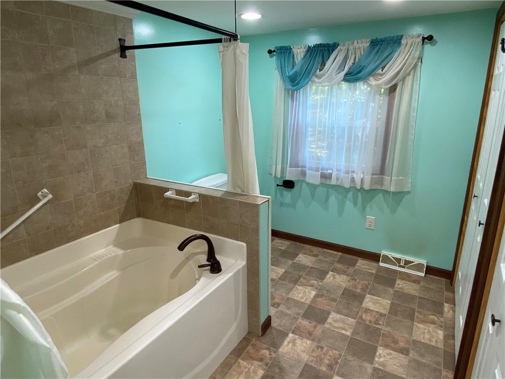 352 Barron Road Slippery Rock, PA 16057 - Photo 14 of 22 a bathroom with a bathtub and a shower