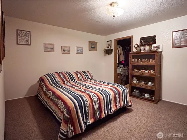 a bedroom with a bed and closet