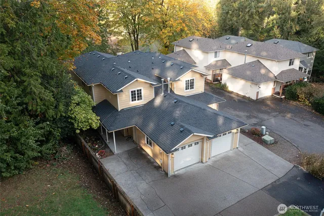 an aerial view of a house with a yard