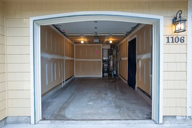 a view of a hallway with wooden floor and entryway