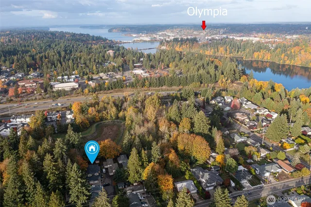 a picture of a bathroom with a white wall and a picture