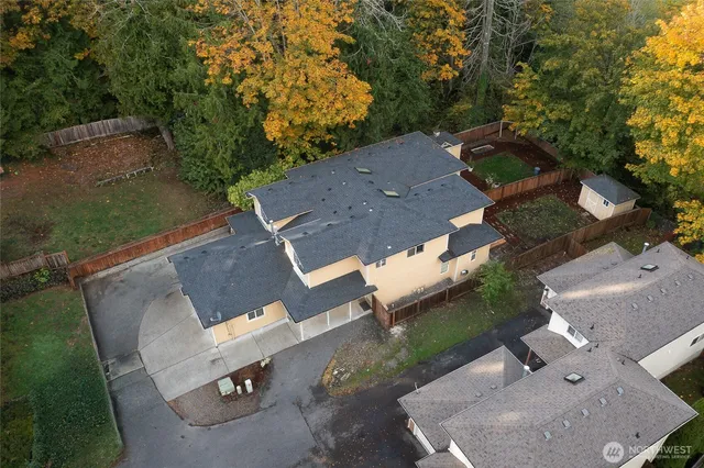 an aerial view of a house with a yard
