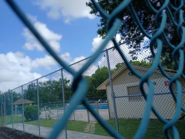 a kitchen with a stove sink and cabinets