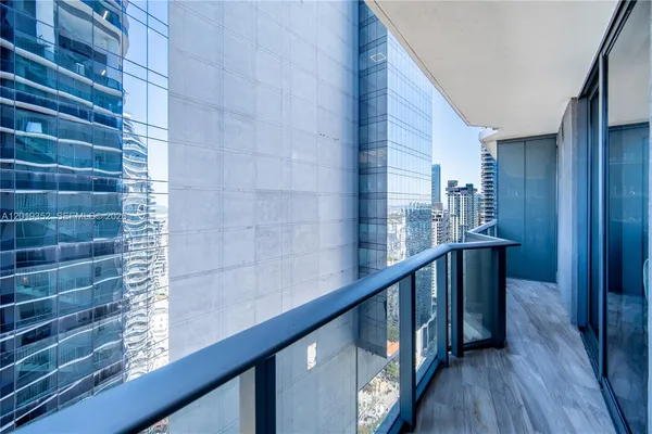 a view of balcony with wooden floor