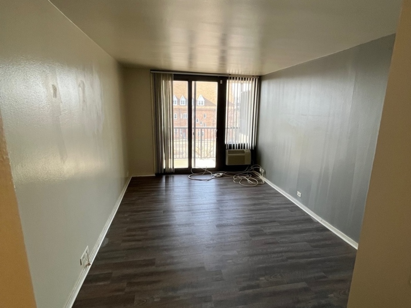 2605 South Indiana Avenue, Unit 301 Chicago, IL 60616 - Photo 11 of 23 a view of a room with wooden floor and window