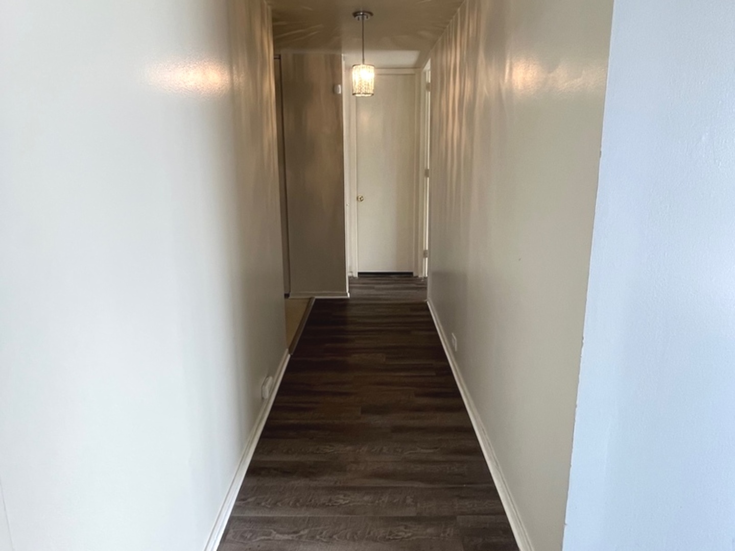 2605 South Indiana Avenue, Unit 301 Chicago, IL 60616 - Photo 18 of 23 a view of a hallway with wooden floor