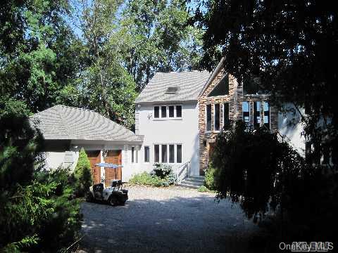 150 Old Field Road Old Field, NY 11733 - Photo 1 of 1 a front view of a house with a garden