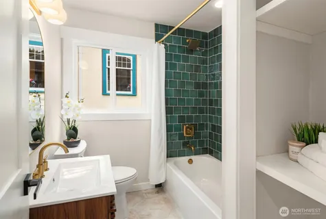 a bathroom with a toilet a sink and bathtub