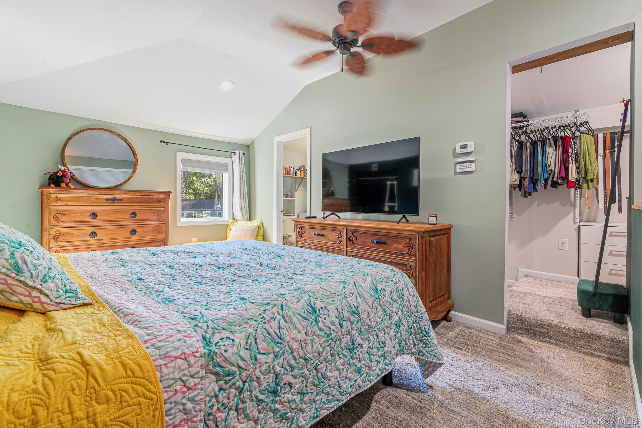 33 Lillian Road Nesconset, NY 11767 - Photo 26 of 42 Another View Of The Stunning Primary Bedroom Suite Offering Beautiful Vaulted/Tray Ceilings, Recessed Lighting, Ceiling Fan, Oversized Windows For Natural Light, Beautiful Details Including Two Wall Cut Outs/Niches, Ample Room For A Large Bedroom Set/Furniture, A Large Walk In Closet With Built In Cabinetry/Shelving & Storage, And A Stunning New Primary Bathroom.